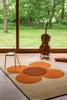 Orla Kiely Flower Placement Floral Rug Pumpkin/Ecru lifestyle picture in the living room