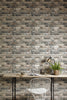 Oslo Grey Brick Wallpaper hung in a styled room setting
