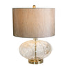 Kyra table lamp with faceted rounded clear glass base, gold-toned accents and textured fabric shade