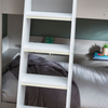 Taupe and white bunk bed for a sophisticated appeal.