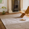 Marimekko Piirto Unikko Floral Rug Greige lifestyle picture in the living room