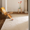 Marimekko Priito Unikko Floral Rug Natural White lifestyle picture in the living room