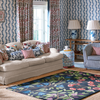 Sanderson Foraging Floral Rug Indigo lifestyle picture in the living room
