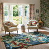Sanderson Robins Wood Floral Rug Forest Green lifestyle picture in the living room