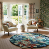 Sanderson Robins Wood Floral Rug Forest Green Round lifestyle picture in the living room