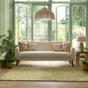 Sanderson Truffle Outdoor Abstract Rug Olive lifestyle picture in the patio