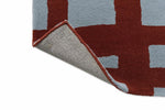 Scion Arlo Geometric Rug Brick with a cotton and latex baking