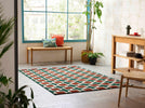 Scion Hatch Geometric Rug Rust lifestyle picture in the living room
