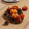Decorative velvet pumpkins with pinecones for home accessories.
