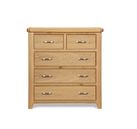 Elegant chest of drawers in light oak.
