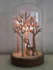 Experience the magic of the season with the Snowtime Glass Dome, adorned with Natural Wood Trees and a graceful Stag."