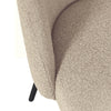 Close-up of a textured beige armchair with a white background