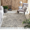 Morris & Co Strawberry Thief Floral Rug Ink lifestyle picture in the living room