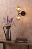 Takara 2 Light Wall Light Black and Bronze life style picture with switched on light
