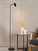 Thierry Task Floor Lamp Matt Black life style picture with switched on light