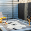 Marimekko Unikko Anniversary Outdoor Floral Rug Grey lifestyle picture outside