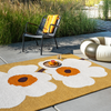 Marimekko Unikko Anniversary Outdoor Floral Rug Honey lifestyle picture outside