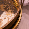 Vela Nest of 2 Tray Tables close view picture of the mirrored top with a floral gold pattern