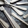 Viners Bead Dessert Spoon in a laid table setting