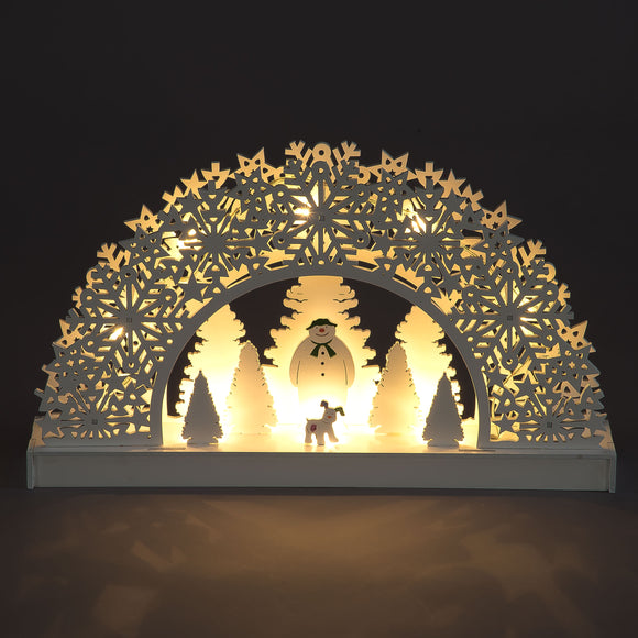 Elevate your holiday decor with the White Carved Arch featuring Snowman and Snow Dog. Add a touch of festive whimsy and charm to your space with this delightful and carved holiday decoration. 