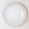 Round mirror with a cream frame and delicate beading for a refined touch.

