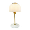 Isra metal table lamp with ribbed dome shade, slim gold-toned stem and pale round base