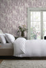 Elegant Wisteria Trails wallpaper with delicate branches in mauve