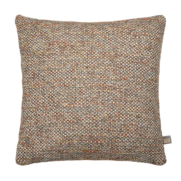 Handmade scatter box cushion with intricate white and copper yarns.