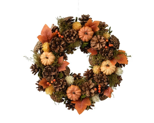 Christmas decoration wreath with leaves and pumpkins