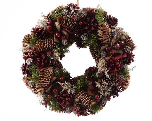Decorative Christmas wreath with pinecones, berries, and festive grass