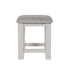 Bedroom dressing stool with soft cushion and painted finish.
