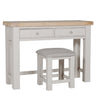 Taupe padded dressing table stool with elegant finish.
