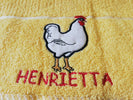 Tea towel featuring Henrietta Hen embroidery.
