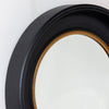 Round black/gold wooden mirror for modern interiors