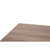 Extreme close-up of the wooden tabletop surface, showing natural grain and smooth finish.

