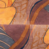 Opulent scatter box cushion in amber with botanical motif