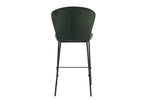 Counter top stool with black coated metal legs and green seat