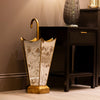 Luxurious Vela Umbrella Stand in gold for stylish entryways
