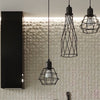 Elegant Sollux Lighting wall lamp SUBA Black illuminating a cozy room.
