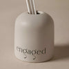 close up of text on engaged reed diffuser 