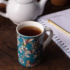 lifestyle hummingbird floral teal mug 