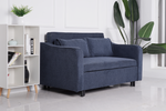 The Serene sofa bed in denim blue in a living room