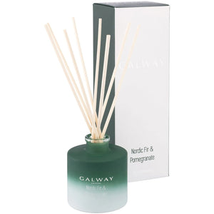 A festive visual of the "Nordic Fir And Pomegranate Diffuser" to set the holiday mood with its scented charm.