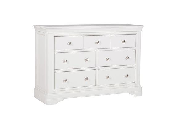 A side view of the Mabel Dressing Chest in Bone, highlighting its sturdy construction and smooth finish. The seven drawers offer versatile storage options, allowing you to keep your essentials neatly organized. The bone color adds a subtle elegance, making it a perfect addition to any modern or traditional bedroom.