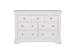 A front view of the Mabel Dressing Chest in Bone, featuring its elegant design and ample storage space. The seven spacious drawers provide convenient organization for your clothing, accessories, and other personal items, while the bone color adds a touch of sophistication to your bedroom decor.