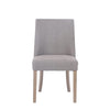 A frontal view of the Rosa Sand Linen Dining Chair, revealing its inviting seating and sophisticated aesthetic.