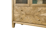  A detailed close-up of the cabinet's closed drawers, highlighting their impeccable craftsmanship.