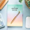 Something Different Multicoloured Gratitude Journal on computer desk