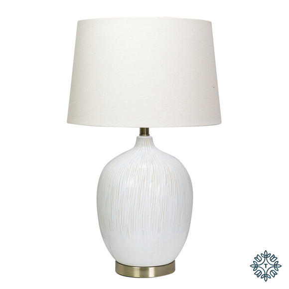 Illuminate your surroundings with the Arianna Table Lamp, a harmonious blend of elegance and functionality that adds a touch of sophistication to any room.