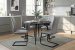Yara black round dining table shown from above (7)